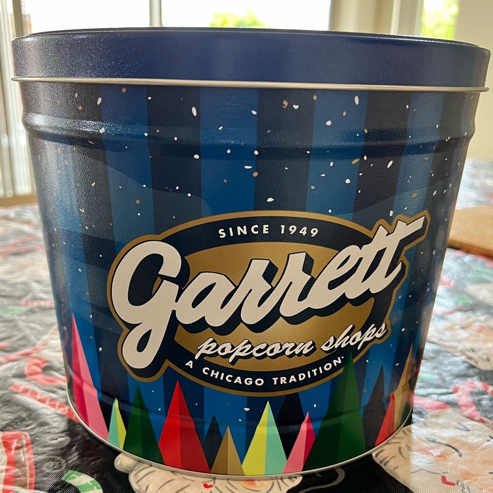A/ Garrett Popcorn Family-size Tin. Popcorn not included.